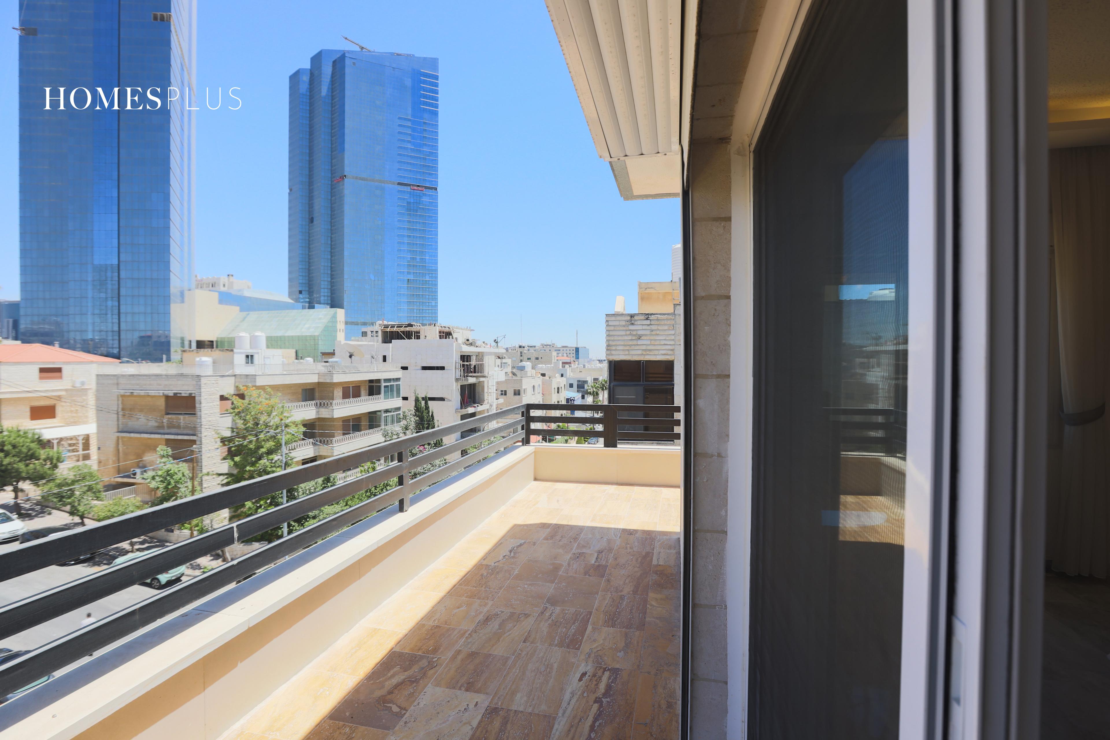 Terrace with a view of a glass tower, Um Uthaina, Amman