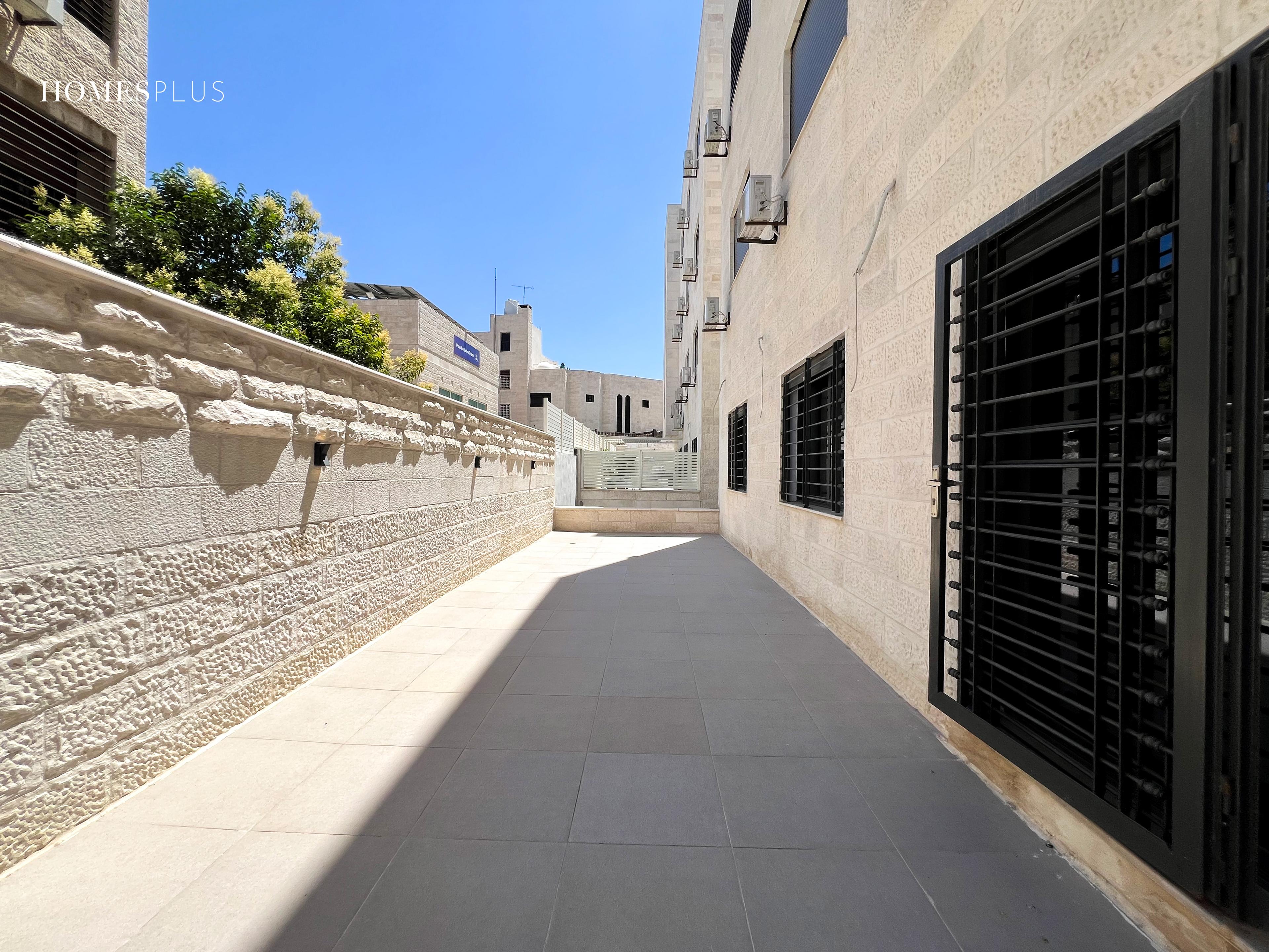 Long side terrace beside an apartment building, Sweifieh, Amman