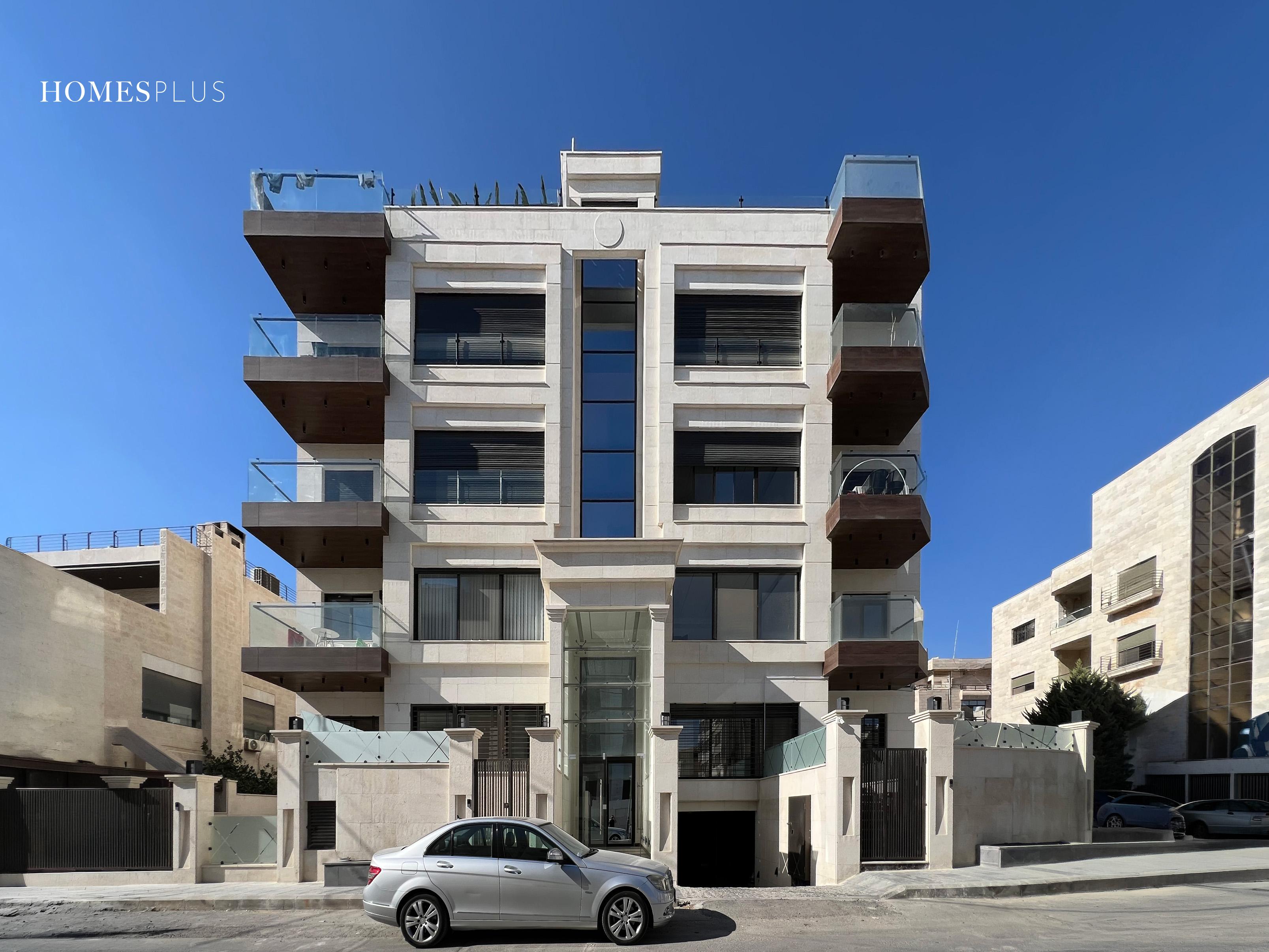 Stone apartment building in Sweifieh, Amman